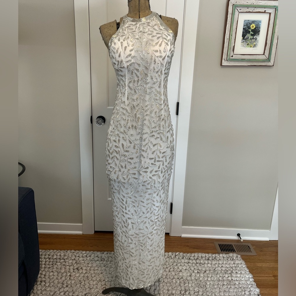 White beaded gown with leaf design, halter style, recently dry cleaned, small